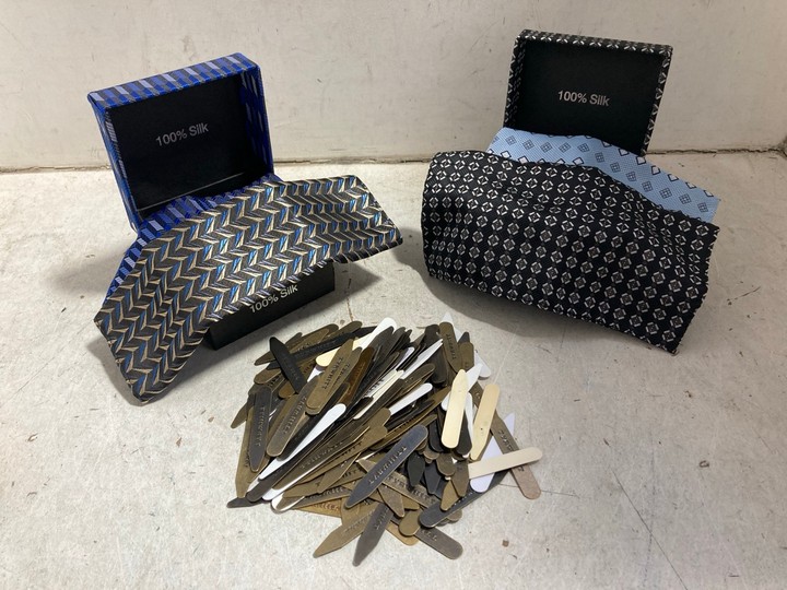 Lot 1030  
            Marchington SR15 - Parcel Delivery Only 

                
2 X GIFT BOXES OF 2 100% SILK HANDKERCHIEFS TO INCLUDE QTY OF ASSORTED BRAND CLOT...