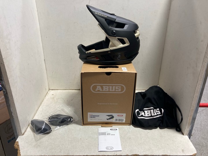 Lot 1060  
            Marchington SR15 - Parcel Delivery Only 

                
ABUS MTB AIRDROP MIPS HELMET IN BLACK/GOLD - SIZE 52-58CM - ORIGINAL RRP £185: LO...