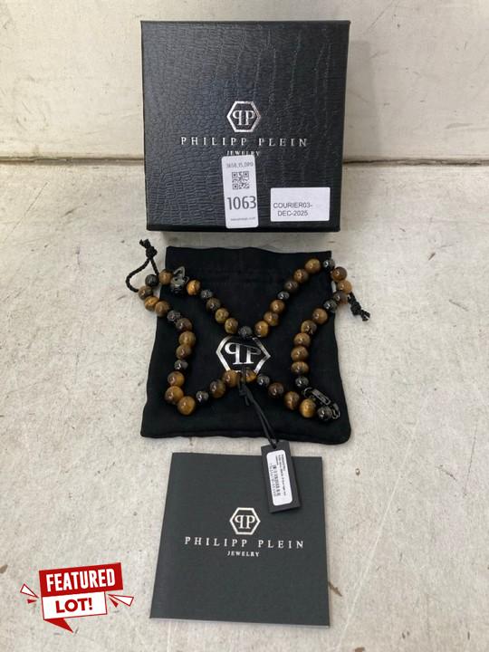Lot 1063  
            Marchington SR15 - Parcel Delivery Only 

                
PHILIPP PLEIN SKULL BEADS NECKLACE IN GUN TIGER EYE - ORIGINAL RRP £180: LOCATION...