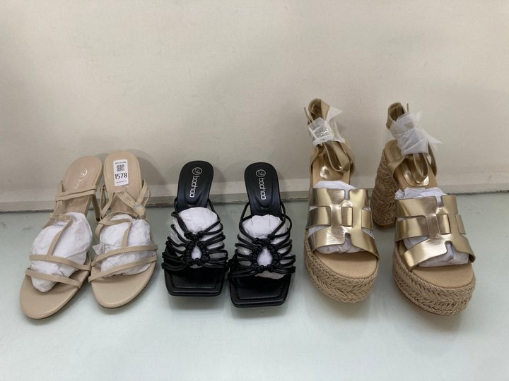 Lot 1578  
            Marchington SR14 - Parcel Delivery Only 

                
3 X ASSORTED WOMEN'S SHOES IN ASSORTED SIZES TO INCLUDE BOOHOO PLATFORM HEELED SA...