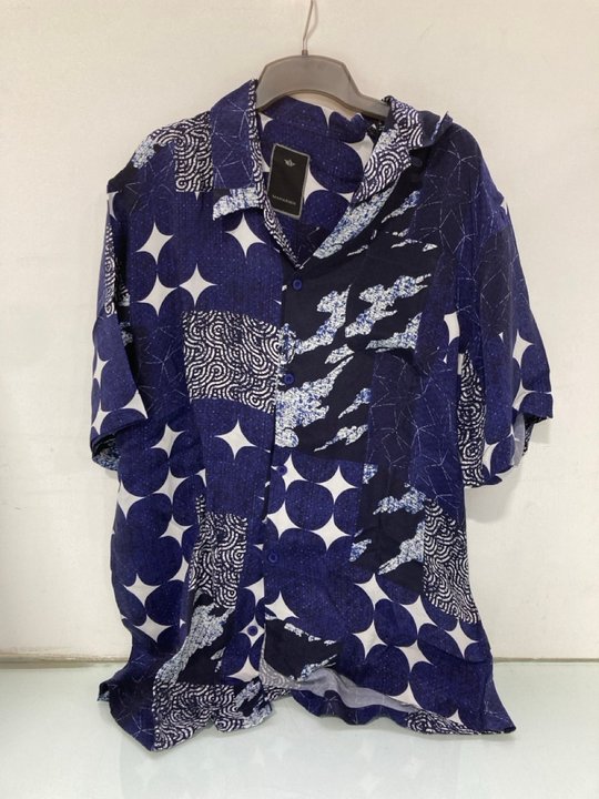 Lot 1614  
            Marchington SR14 - Parcel Delivery Only 

                
MAHARISHI SASHIKO PATCHWORK SUMMER SHIRT IN NAVY - UK LARGE - ORIGINAL RRP: £325:...