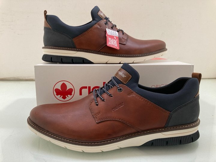 Lot 215  
            Marchington SR14 - Parcel Delivery Only 

                
RIEKER DUSTIN MENS SLIP ON SHOES IN BROWN AND NAVY LEATHER UK SIZE 10.5: LOCATION...