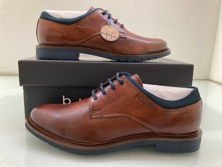 Lot 216  
            Marchington SR14 - Parcel Delivery Only 

                
BUGATTI 6300 COGNAC SHOES IN BROWN LEATHER EU SIZE 43: LOCATION - A7