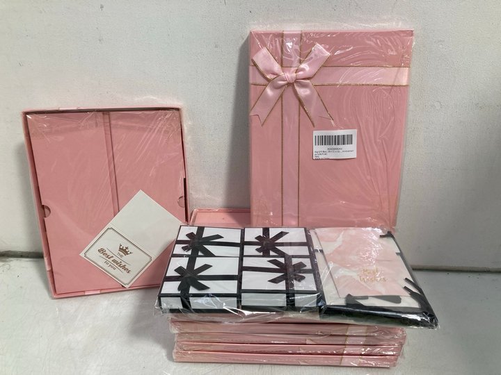 Lot 667  
            Marchington SR14 - Parcel Delivery Only 

                
QTY OF POP UP GIFT BOXES WITH LIDS AND RIBBONS IN PINK/WHITE: LOCATION - B10