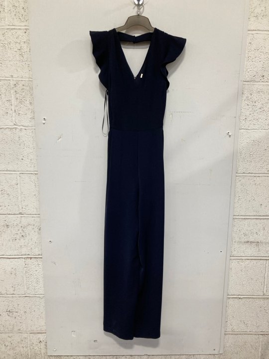 Lot 720  
            Marchington SR14 - Parcel Delivery Only 

                
PHASE EIGHT KALLIE FRILL JUMPSUIT IN NAVY - UK 14 - ORIGINAL RRP £139: LOCATION - B6