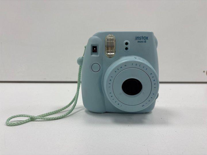 Lot 152  
            Marchington - Parcel Delivery Only 

                
FUJIFILM INSTAX MINI 8 POLAROID CAMERA IN PASTEL BLUE. (WITH CASE) [JPTM151390]