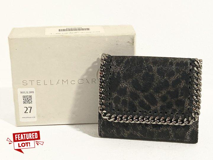 Lot 27  
            Marchington SR12 - Parcel Delivery Only 

                
STELLA MCCARTNEY FALABELLA SMALL FLAP WALLET IN ANIMAL PRINT - ORIGINAL RRP: £295...