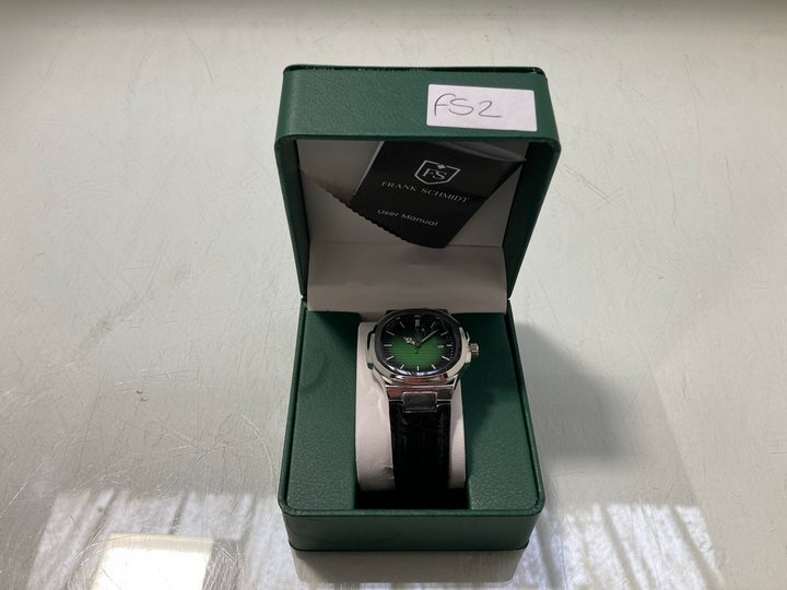 Lot 296  
            Marchington SR12 - Parcel Delivery Only 

                
FRANK SCHMIDT MEN'S AMBASSADOR WATCH. FEATURING A GREEN TEXTURED DIAL, SILVER COL...