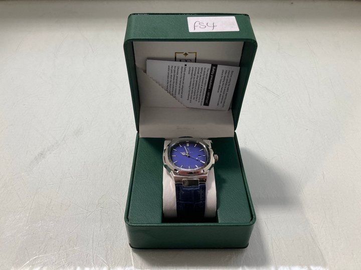 Lot 298  
            Marchington SR12 - Parcel Delivery Only 

                
FRANK SCHMIDT MEN'S AMBASSADOR WATCH. FEATURING A BLUE TEXTURED DIAL, ROSE GOLD C...