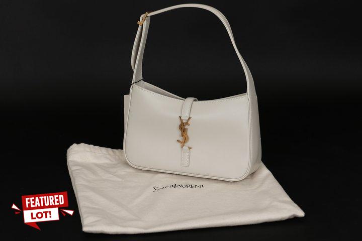 Lot 2  
            Marchington SR12 - Parcel Delivery Only 

                
SAINT LAURENT LE 5 À 7 HOBO BAG IN SMOOTH CREAM LEATHER TO INCLUDE A PROTECTIVE C...