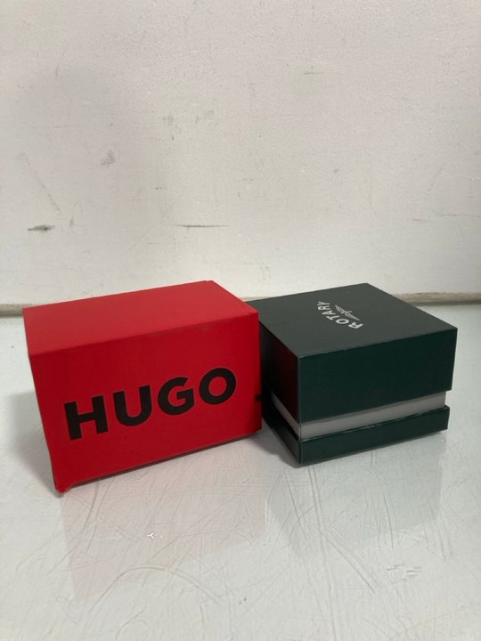 Lot 456  
            Marchington SR12 - Parcel Delivery Only 

                
ROTARY ANALOGUE WATCH IN BLACK TO INCLUDE HUGO ANALOGUE WATCH IN BLACK/RED: LOCAT...