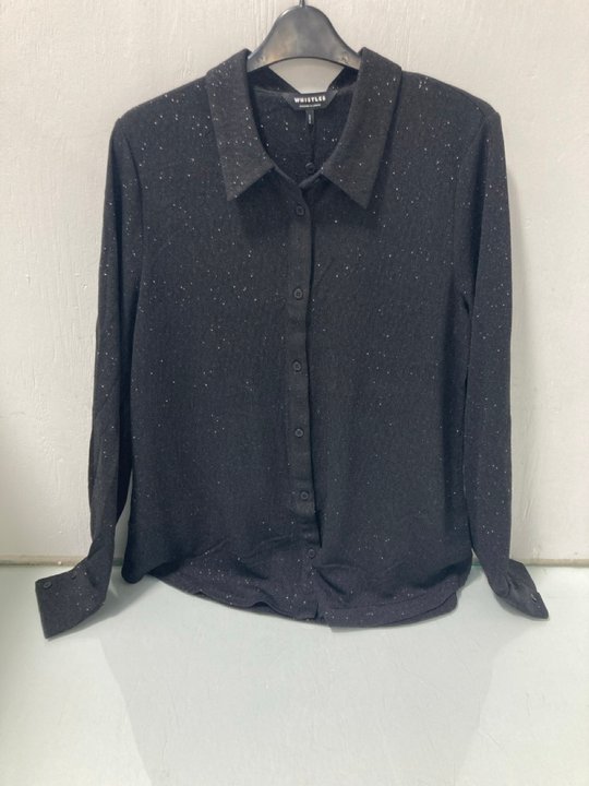 Lot 581  
            Marchington SR12 - Parcel Delivery Only 

                
WHISTLES EVA SPARKLE SHIRT IN BLACK UK SIZE 14 ORIGINAL RRP £89.00: LOCATION - I6