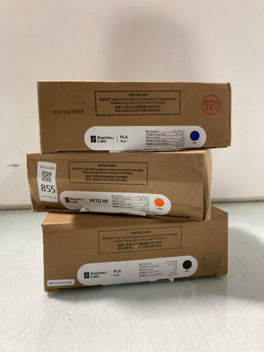 Lot 855  
            Marchington SR12 - Parcel Delivery Only 

                
3 X BAMBU LAB 3D PRINTING FILAMENT IN BLUE/ORANGE/BLACK: LOCATION - H8