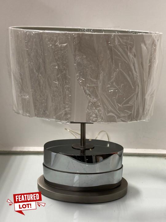 Lot 1006  
            Marchington SR11 - Parcel Delivery Only 

                
TODD TABLE LAMP IN SMOKED FINISH WITH NATURAL SHADE - ORIGINAL RRP £460: LOCATION...