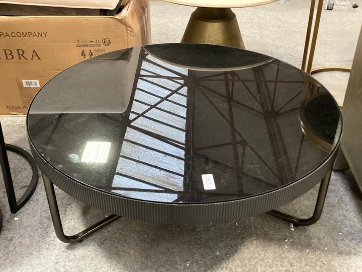 Lot 174  
            Marchington SR11 - Delivery or Collection 

                
MODERN STYLE ROUND COFFEE TABLE IN BLACK GLASS TOP AND BLACK METAL FINISH: LOCATI...