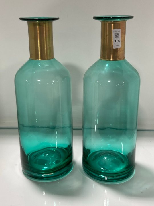 Lot 214  
            Marchington SR11 - Collection 

                
(COLLECTION ONLY) 2 X TALL VASES IN GREEN AQUA GLASS AND BRASS FINISH: LOCATION - C3
