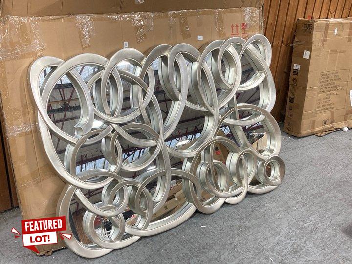 Lot 397  
            Marchington SR11 - Delivery or Collection 

                
SWIRL FRONT MIRROR IN SILVER: LOCATION - A3W