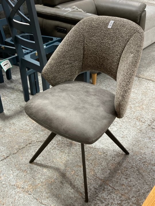 Lot 94  
            Marchington SR11 - Delivery or Collection 

                
OAK FURNITURELAND NICO SWIVEL DINING CHAIR IN DARK GREY WITH BLACK METAL LEGS ORI...