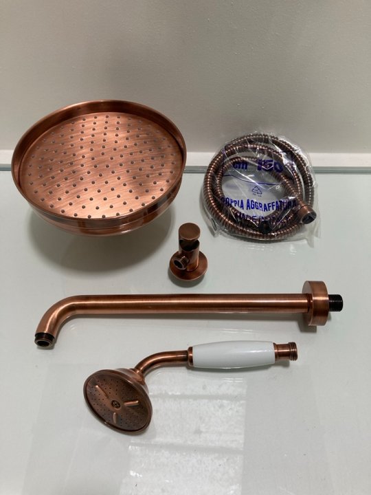 Lot 292  
            Marchington SR19 - Delivery or Collection 

                
TRADITIONAL ROSE SHOWER HEAD IN COPPER WITH WALL MOUNTED ARM WITH SHOWER HANDSET,...