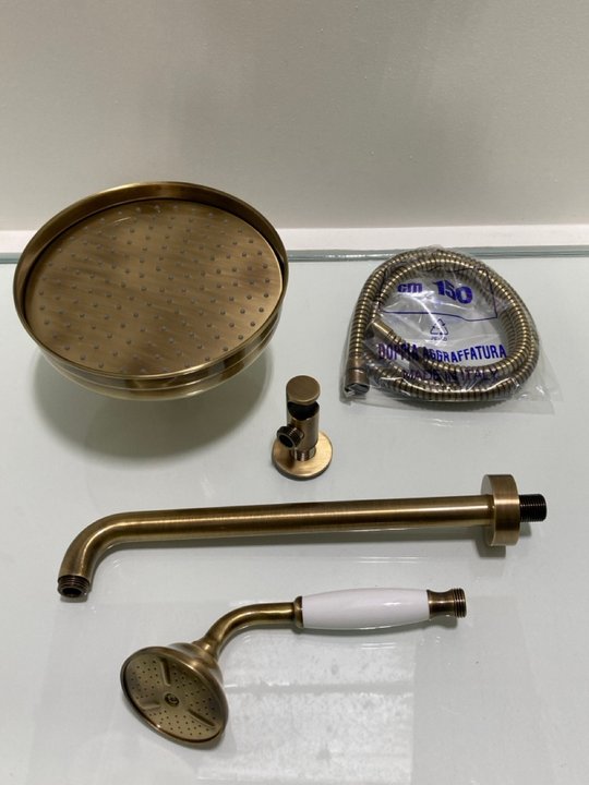 Lot 296  
            Marchington SR19 - Delivery or Collection 

                
TRADITIONAL ROSE SHOWER HEAD IN BRONZE WITH WALL MOUNTED ARM WITH SHOWER HANDSET,...