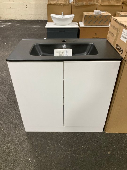 Lot 32  
            Marchington SR19 - Delivery or Collection 

                
FLOOR STANDING 2 DOOR SINK UNIT IN WHITE WITH A 810 X 460MM 1TH BLACK CERAMIC BAS...