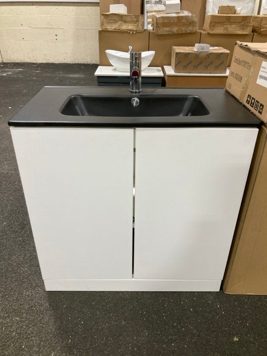 Lot 33  
            Marchington SR19 - Delivery or Collection 

                
FLOOR STANDING 2 DOOR SINK UNIT IN WHITE WITH A 810 X 460MM 1TH BLACK CERAMIC BAS...