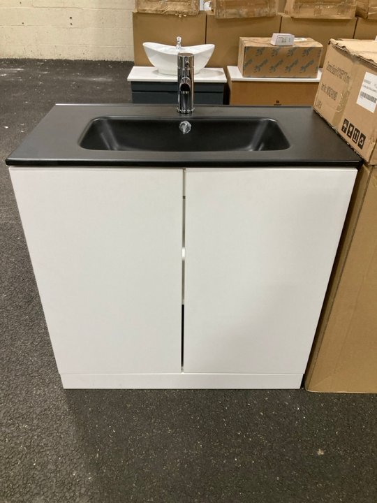 Lot 35  
            Marchington SR19 - Delivery or Collection 

                
FLOOR STANDING 2 DOOR SINK UNIT IN WHITE WITH A 810 X 460MM 1TH BLACK CERAMIC BAS...