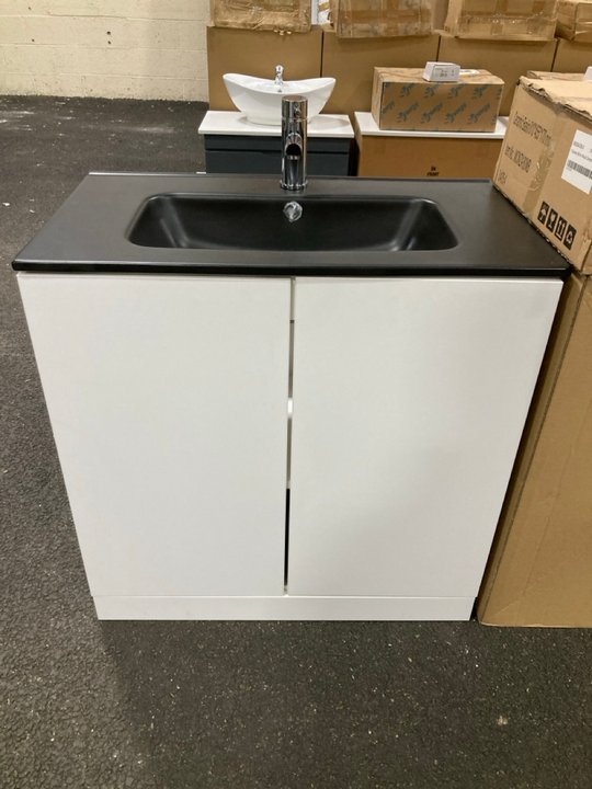 Lot 36  
            Marchington SR19 - Delivery or Collection 

                
FLOOR STANDING 2 DOOR SINK UNIT IN WHITE WITH A 810 X 460MM 1TH BLACK CERAMIC BAS...
