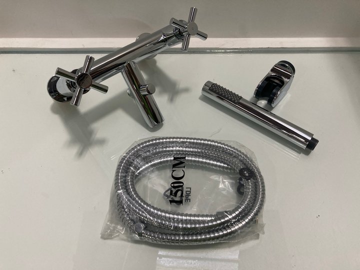 Lot 596  
            Marchington SR19 - Delivery or Collection 

                
DECK MOUNTED BSM IN CHROME WITH PENCIL STYLE HANDSET, HOSE & WALL MOUNTING BRACKE...