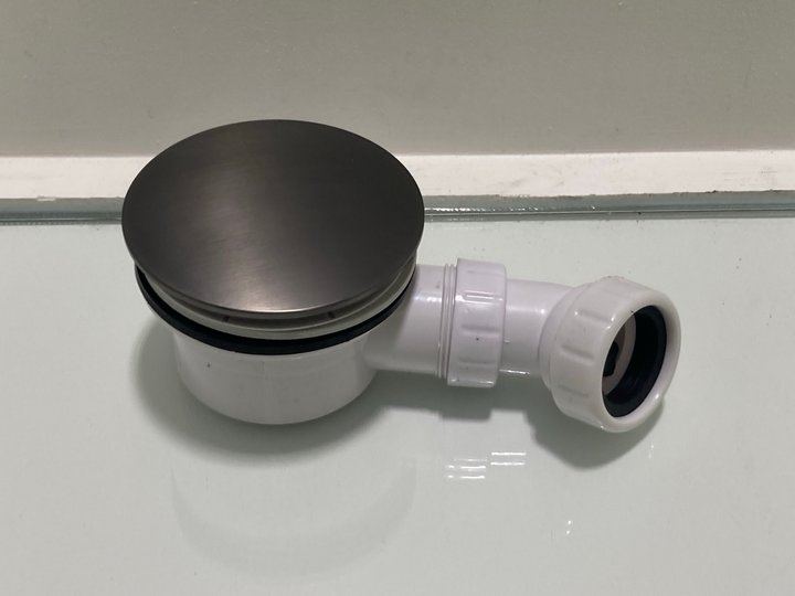 Lot 611  
            Marchington SR19 - Delivery or Collection 

                
90MM FAST FLOW SHOWER WASTE IN GUN METAL WITH OUTLET ELBOW - ORIGINAL RRP £95: LO...