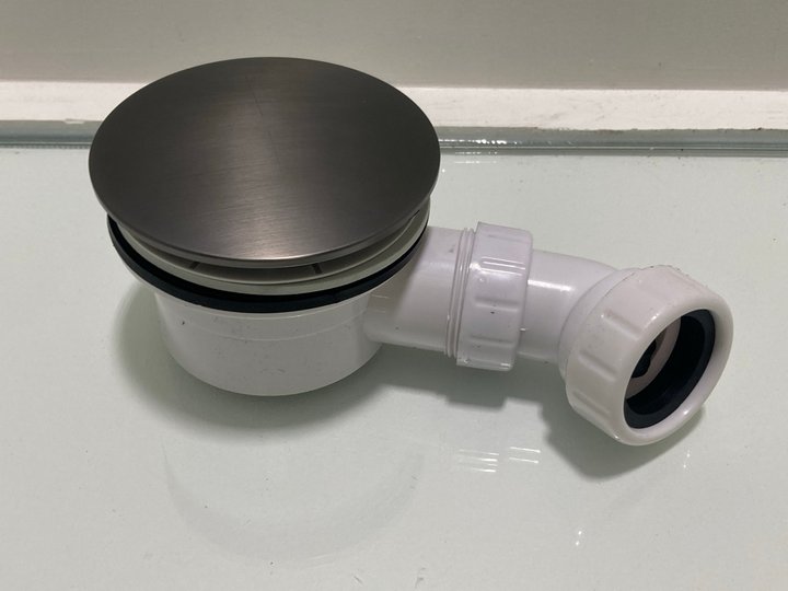 Lot 614  
            Marchington SR19 - Delivery or Collection 

                
90MM FAST FLOW SHOWER WASTE IN GUN METAL WITH OUTLET ELBOW - ORIGINAL RRP £95: LO...