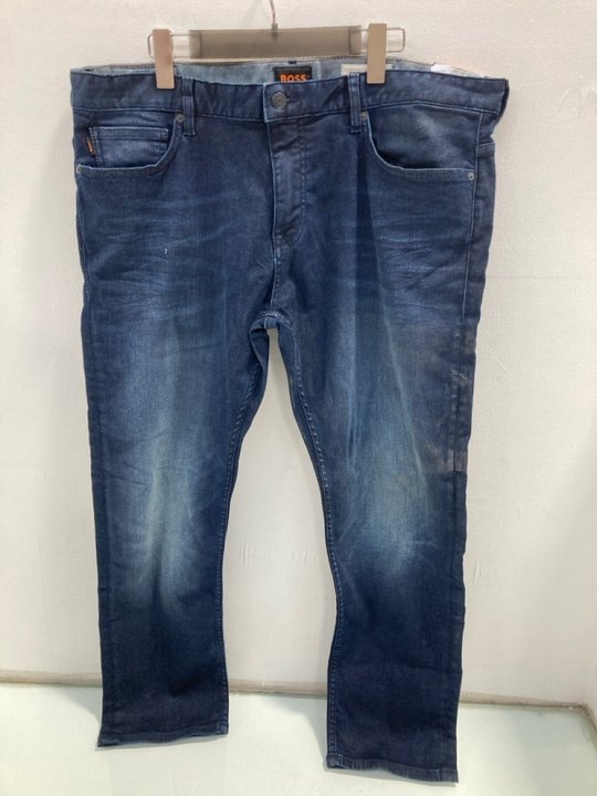 Lot 1029  
            Marchington SR13 - Parcel Delivery Only 

                
HUGO BOSS SOFT MOTION SLIM DENIM BLUE JEANS - UK SIZE: 38/30 - ORIGINAL RRP: £130...