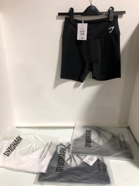 Lot 1505  
            Marchington SR13 - Parcel Delivery Only 

                
3 X GYMSHARK RUCHED STRAPPY SPORTS BRAS IN GREEN, WHITE & BLACK - SIZE UK M TO IN...