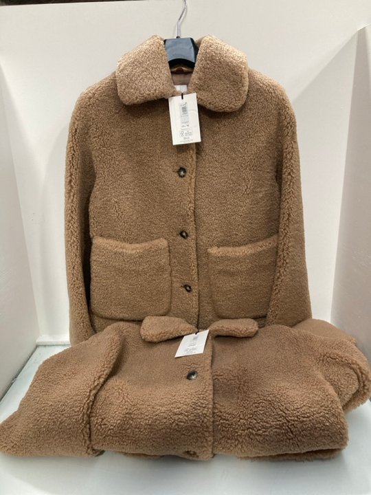 Lot 587  
            Marchington SR13 - Parcel Delivery Only 

                
2 X JOHN LEWIS & PARTNERS TEDDY COATS IN NEUTRAL - UK SIZES: 10 AND 8 - COMBINED ...