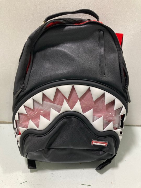 Lot 653  
            Marchington SR13 - Parcel Delivery Only 

                
SPRAYGROUND LIMITED EDITION NEVER PRODUCED AGAIN LADIES VEGAN LEATHER RUCKSACK IN...