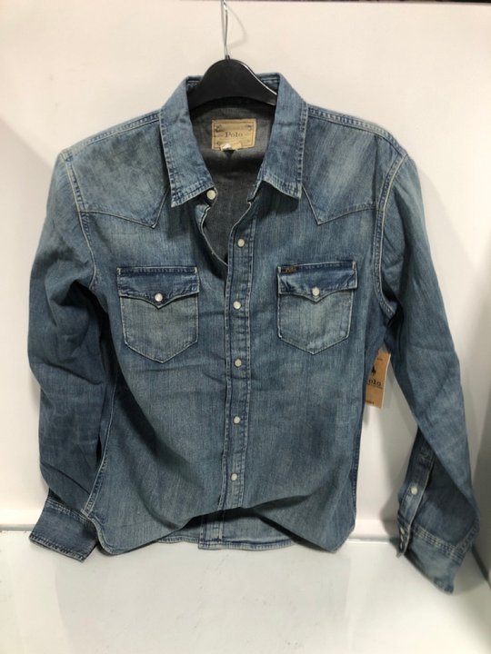 Lot 734  
            Marchington SR13 - Parcel Delivery Only 

                
POLO RALPH LAUREN WESTERN SHIRT IN BLUE - SIZE UK M - ORIGINAL RRP £219: LOCATION...