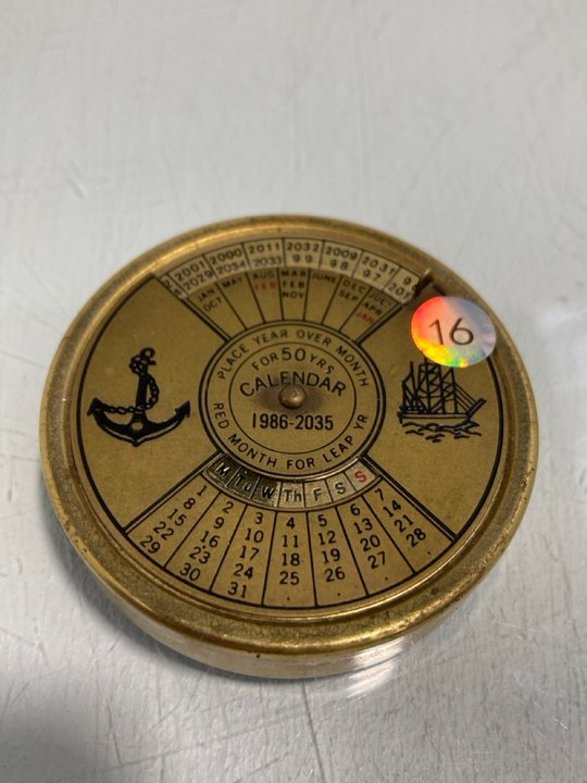 Lot 877  
            Marchington SR13 - Parcel Delivery Only 

                
1986-2035 BRASS POCKET CALENDAR: LOCATION - D3