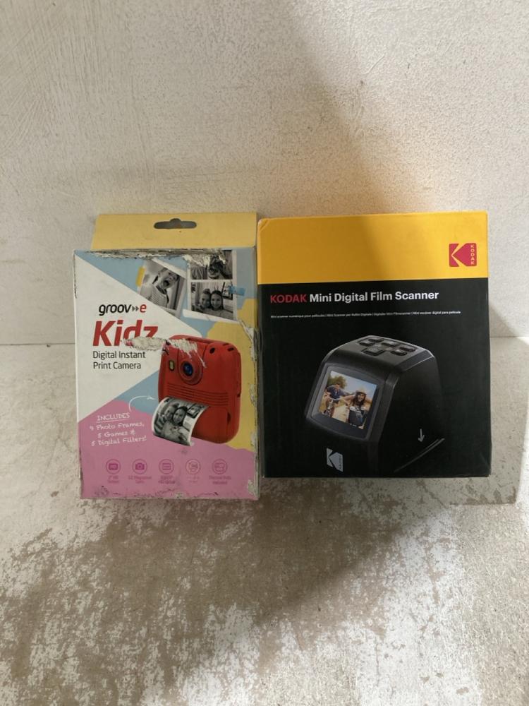 Lot 702  
            Birmingham SR107 - Parcel Delivery Only 

                
GROOVE KIDS DIGITAL PRINT CAMERA, KODAK MINI DIGITAL FILM SCANNER