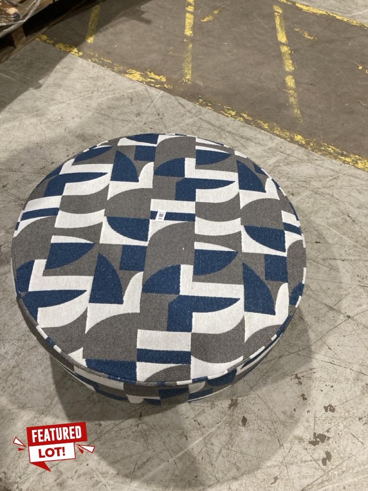 Lot 351  
            Birmingham SR104 - Collection or Optional Delivery Available 

                
OAK FURNITURELAND LEVI ROUND FOOTSTOOL IN ASHER OCEAN FABRIC ORIGINAL RRP £449.99
