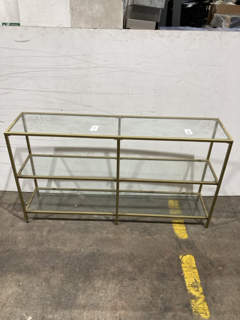 Lot 124  
            Birmingham - Collection Only 

                
DAVID PHILLIPS SHELVING UNIT IN BRASS/GLASS ORIGINAL RRP £400