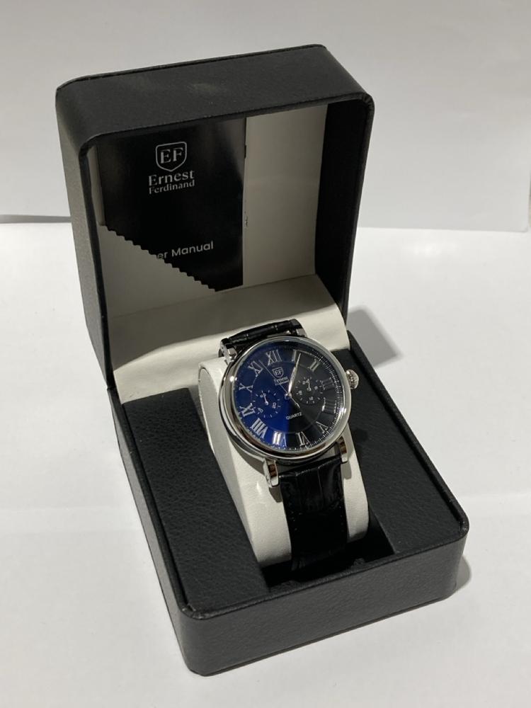 Lot 123  
            Chesterfield SR44 - Parcel Delivery Only 

                
MENS ERNEST FERDINAND WATCH – FUNCTIONING SUBDIALS – LEATHER STRAP – GLASS EXHIBI...