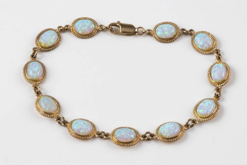 Lot 121  
            Nottingham Luxury Room - Delivery Only 

                
9K Yellow Opal Bracelet, 19cm, 8.6g.  Auction Guide: £200-£250 (VAT Only Payable ...
