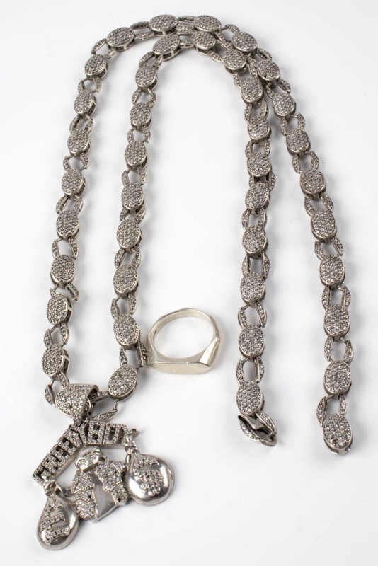 Lot 130  
            Nottingham Luxury Room - Delivery Only 

                
Silver Ring, Size O½. Silver Clear Stone Pavé 'Greedy Boy' Necklace, 73cm (Faulty...