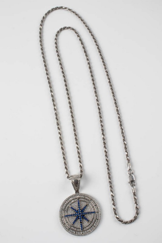 Lot 148  
            Nottingham Luxury Room - Delivery Only 

                
Silver Clear and Blue Stone Pavé Disc Pendant, 4.5x3cm with Silver Rope Chain, 71...