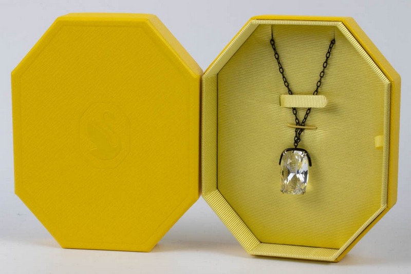 Lot 150  
            Nottingham Luxury Room - Delivery Only 

                
Swarovski White Gold Plated Metal Clear Crystal Pendant, 2.8x2cm and Black Metal ...