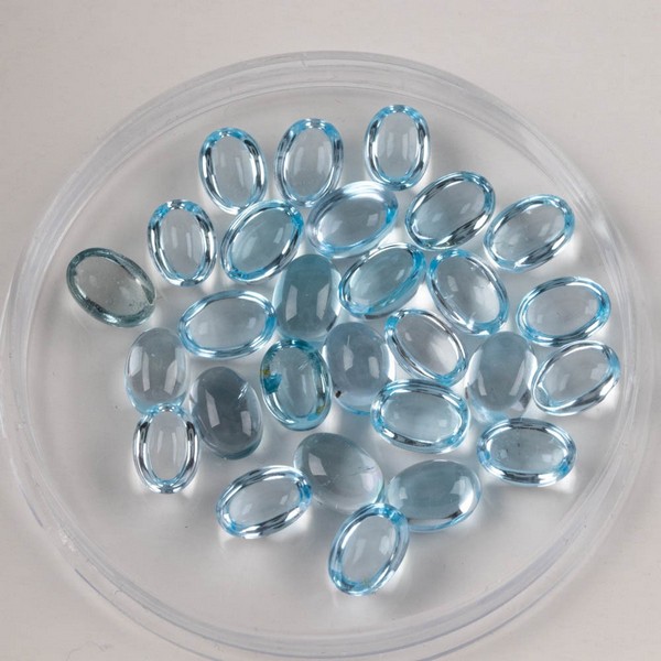 Lot 184  
            Nottingham Luxury Room - Delivery Only 

                
27.41ct Sky Blue Topaz Cabochon Oval-cut Parcel of Gemstones, 7x5mm