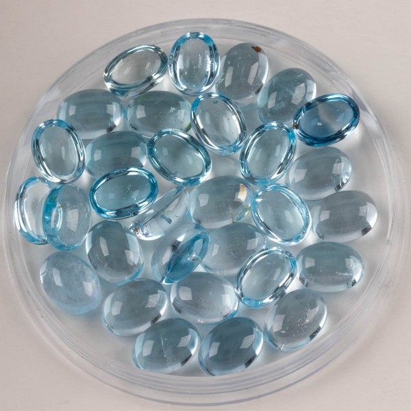 Lot 185  
            Nottingham Luxury Room - Delivery Only 

                
50.79ct Sky Blue Topaz Cabochon Oval-cut Parcel of Gemstones, 8x6mm