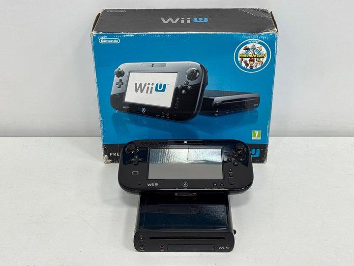 Lot 82  
            Marchington - Parcel Delivery Only 

                
NINTENDO WII U 32GB GAMES CONSOLE IN BLACK: MODEL NO WUP-101(03, WITH BOX, CONSOL...