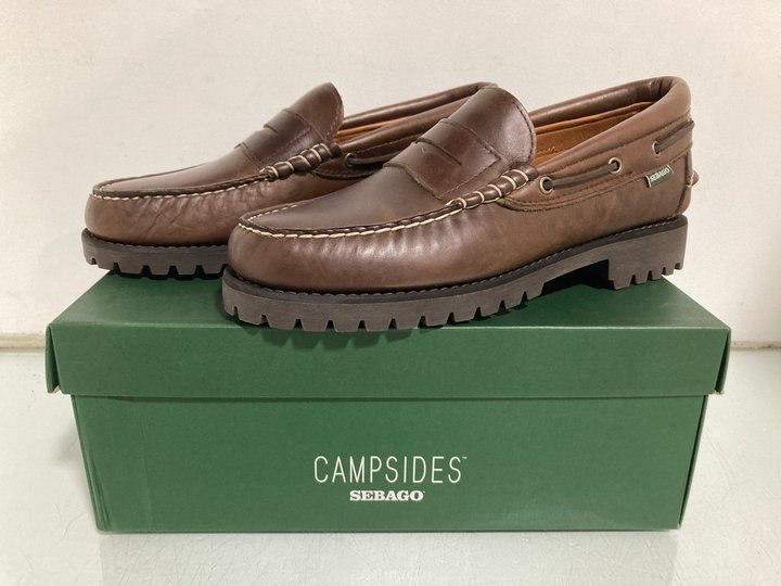 Lot 453  
            Marchington SR13 - Parcel Delivery Only 

                
MENS CAMPSIDES SEBAGO ACADIA MOCASSIN IN TOTAL DARK BROWN - UK SIZE: 10 - ORIGINA...