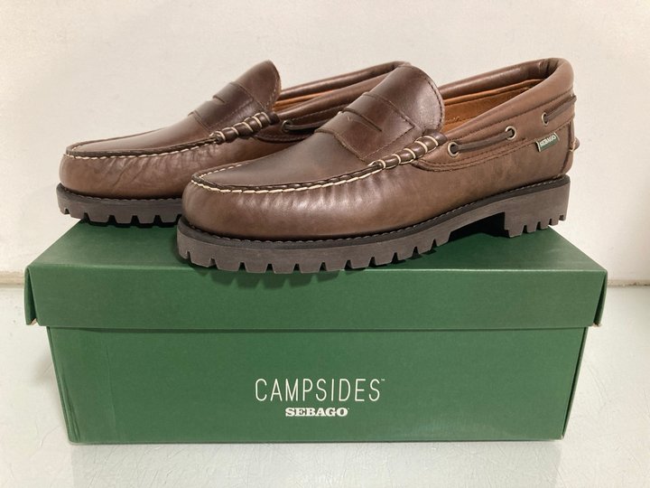 Lot 457  
            Marchington SR13 - Parcel Delivery Only 

                
MENS CAMPSIDES SEBAGO ACADIA MOCASSIN IN TOTAL DARK BROWN - UK SIZE: 11- ORIGINAL...